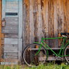 Old wooden wall and green bicycle